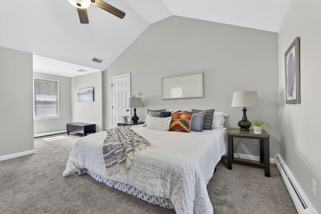 111 Goss Lane Lancaster, MA 01523 - Photo 21 of 39 a bedroom with a bed and painting on the wall