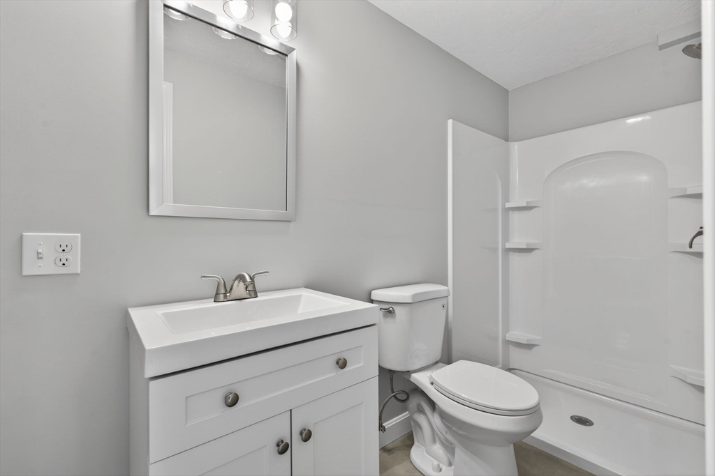 111 Goss Lane Lancaster, MA 01523 - Photo 25 of 39 a bathroom with a sink toilet and vanity