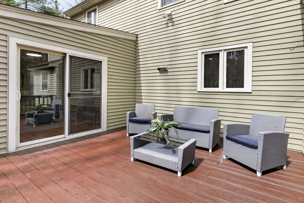 111 Goss Lane Lancaster, MA 01523 - Photo 32 of 39 a view of a deck with furniture