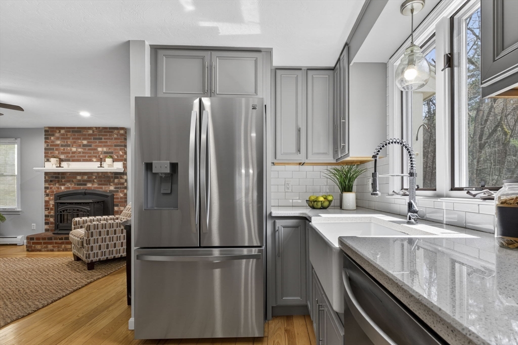 111 Goss Lane Lancaster, MA 01523 - Photo 6 of 39 a kitchen with a refrigerator and a sink