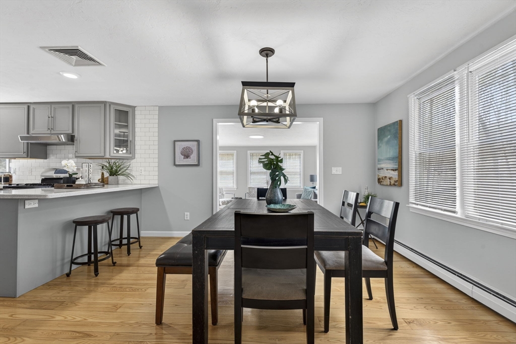 111 Goss Lane Lancaster, MA 01523 - Photo 9 of 39 a dining room with wooden floor and breakfast area