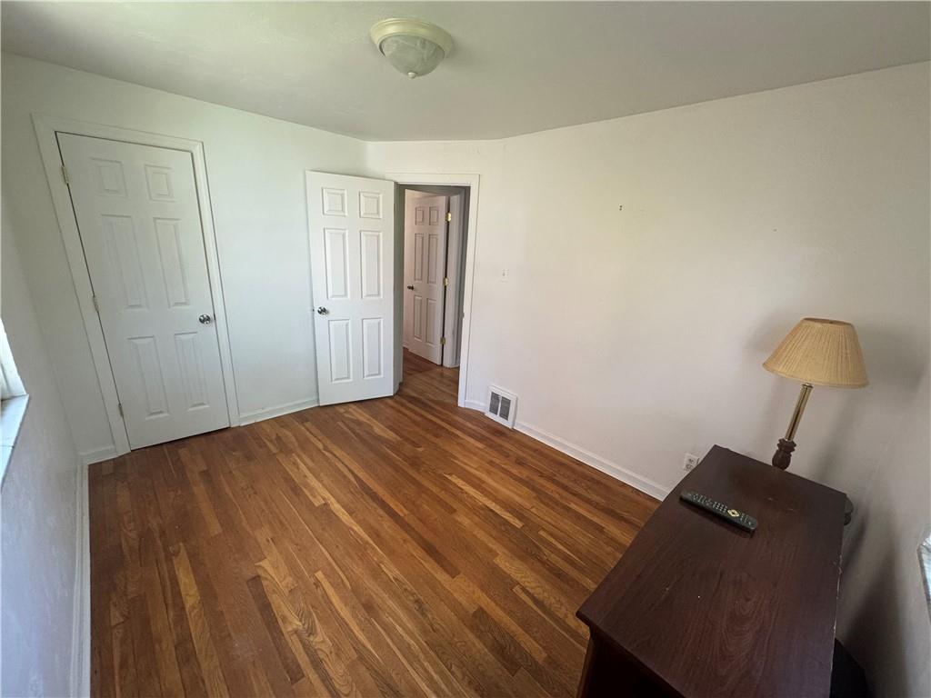 626 Ridgemont Drive Pittsburgh, PA 15220 - Photo 13 of 18 a bed room with a bed and a chair