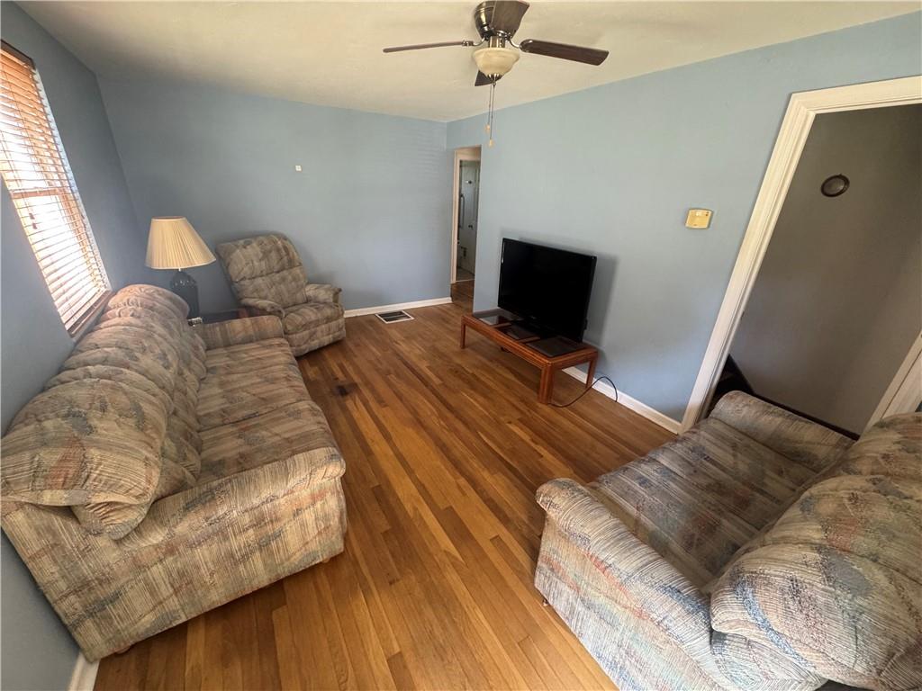 626 Ridgemont Drive Pittsburgh, PA 15220 - Photo 3 of 18 a bed sitting in a bedroom and chair next to a window