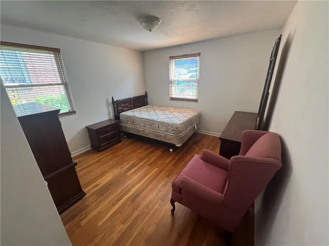 a bedroom with furniture and a window