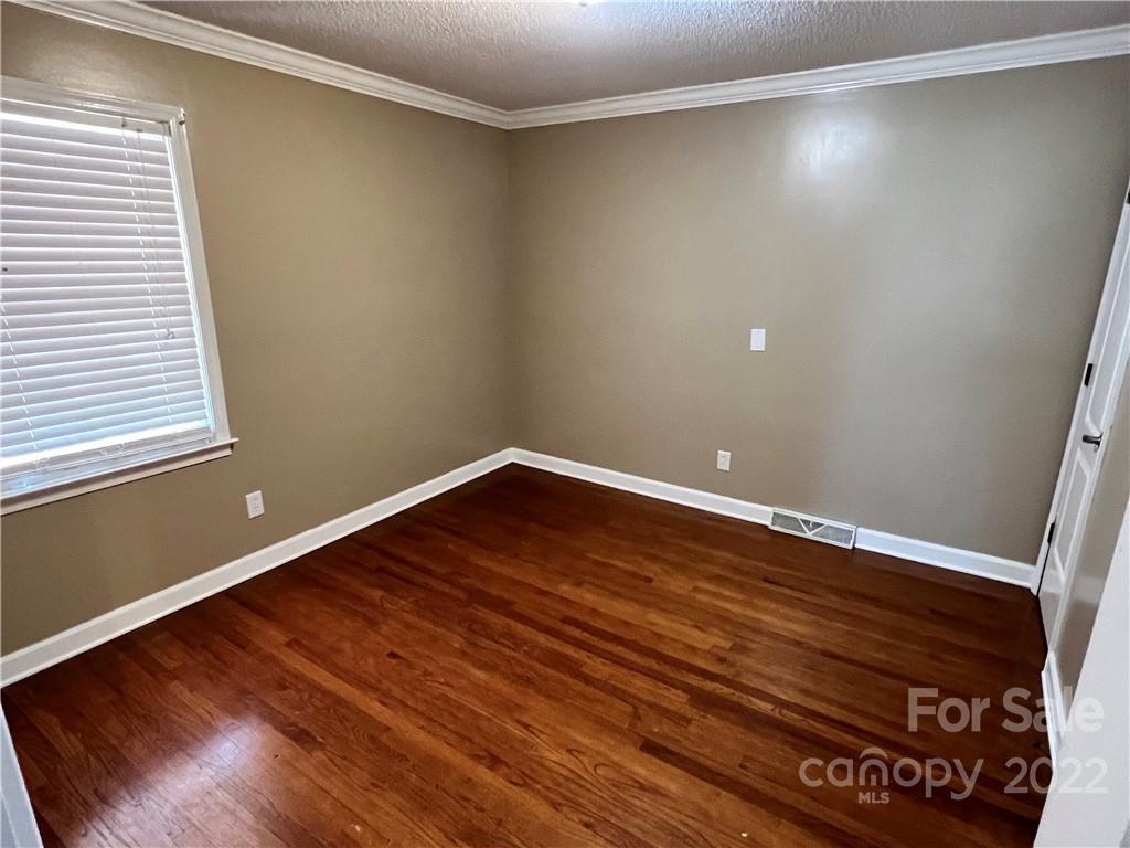 4114 Hartsville-Ruby Road Patrick, SC 29584 - Photo 12 of 48 a view of an empty room with wooden floor and a window