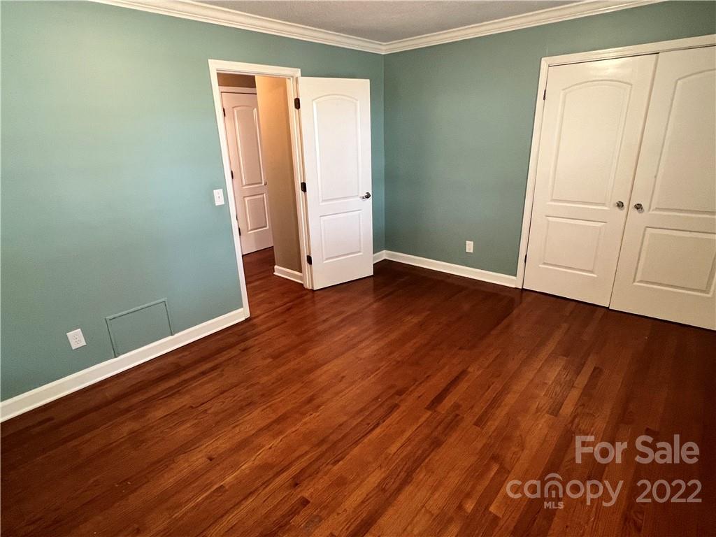 4114 Hartsville-Ruby Road Patrick, SC 29584 - Photo 16 of 48 an empty room with wooden floor and closet