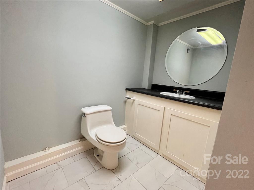 4114 Hartsville-Ruby Road Patrick, SC 29584 - Photo 32 of 48 a bathroom with a toilet a sink and mirror