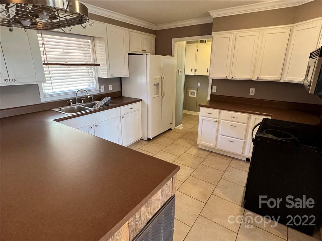 4114 Hartsville-Ruby Road Patrick, SC 29584 - Photo 5 of 48 a kitchen with stainless steel appliances a refrigerator sink and cabinets