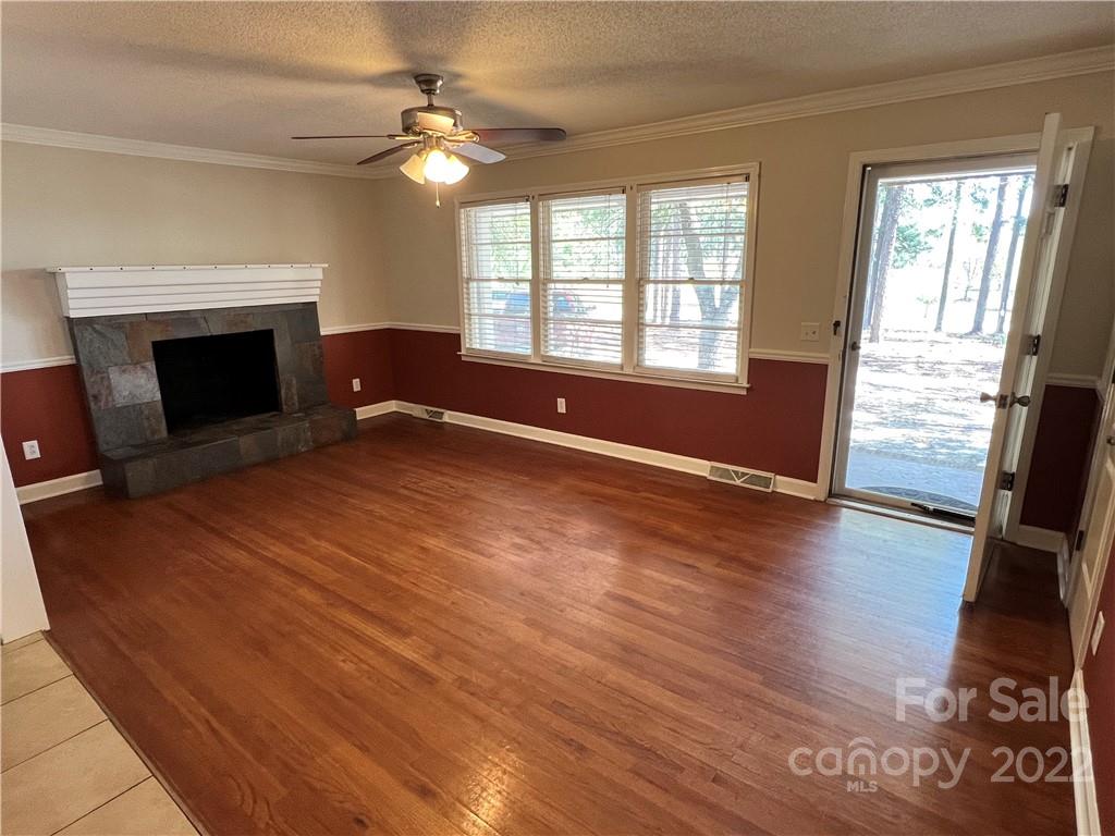 4114 Hartsville-Ruby Road Patrick, SC 29584 - Photo 6 of 48 wooden floor fireplace and windows in an empty room