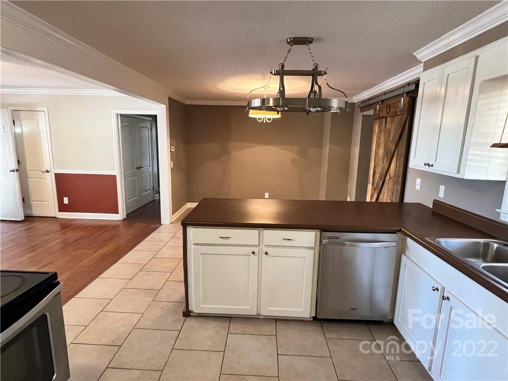 4114 Hartsville-Ruby Road Patrick, SC 29584 - Photo 8 of 48 a kitchen with granite countertop a stove sink and cabinets