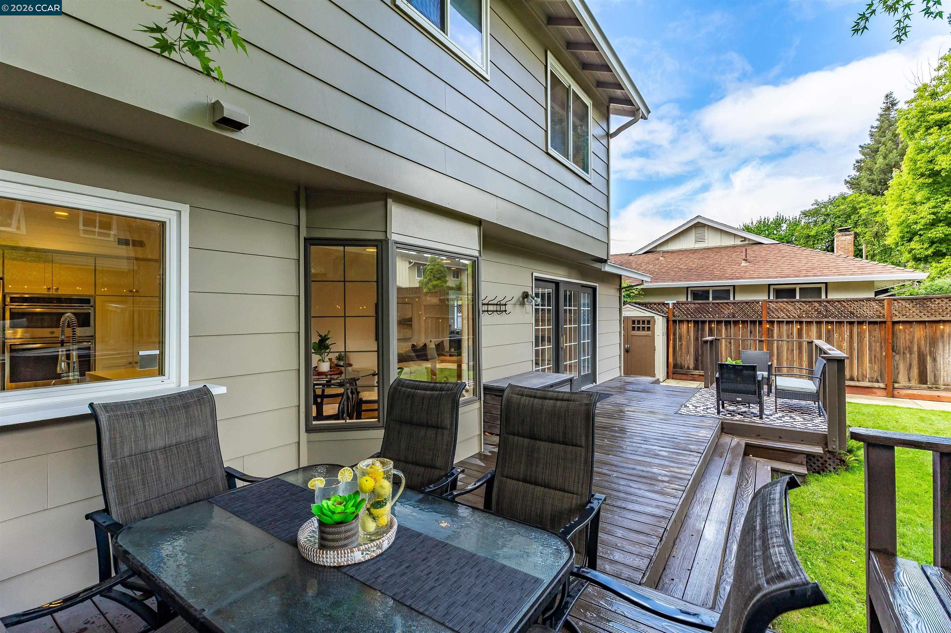 418 Devon Court San Ramon, CA 94583 - Photo 41 of 62 a view of a patio with couches chairs potted plants and wooden floor