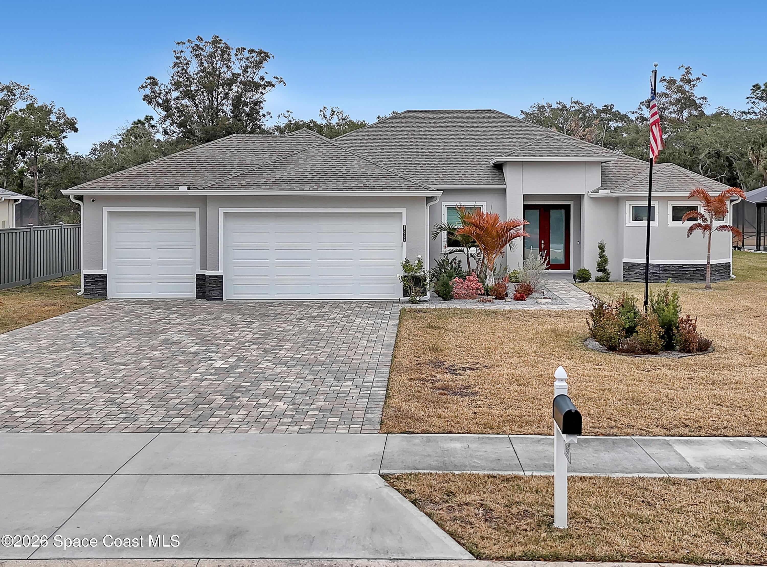 a front view of a house with garden