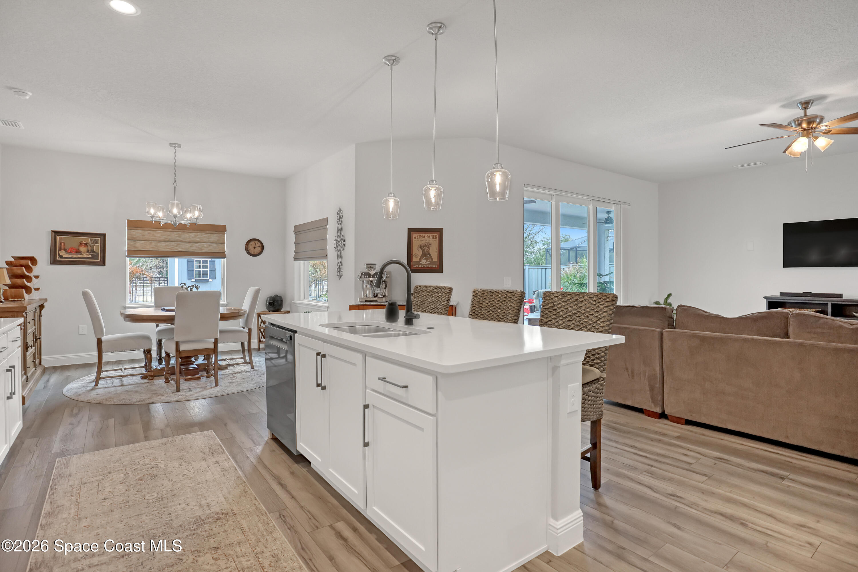 1837 Market Circle Northeast Palm Bay, FL 32905 - Photo 11 of 57 a large kitchen with cabinets a sink a counter space and stainless steel appliances