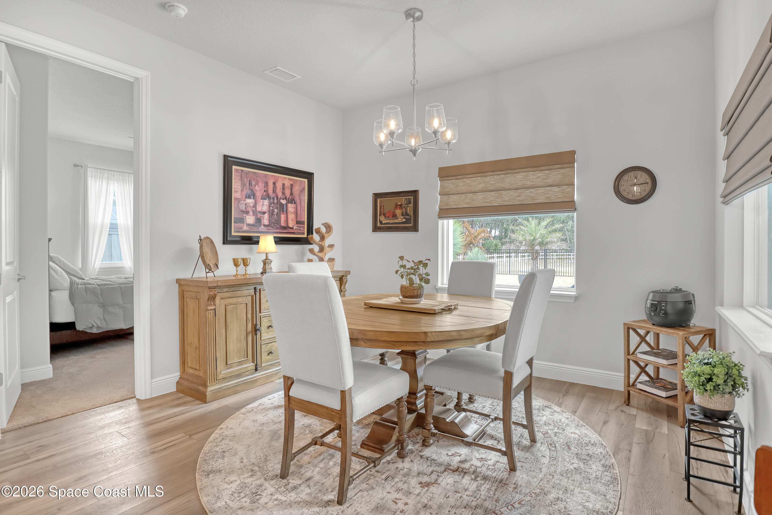 1837 Market Circle Northeast Palm Bay, FL 32905 - Photo 14 of 57 a view of a dining room with furniture and a chandelier