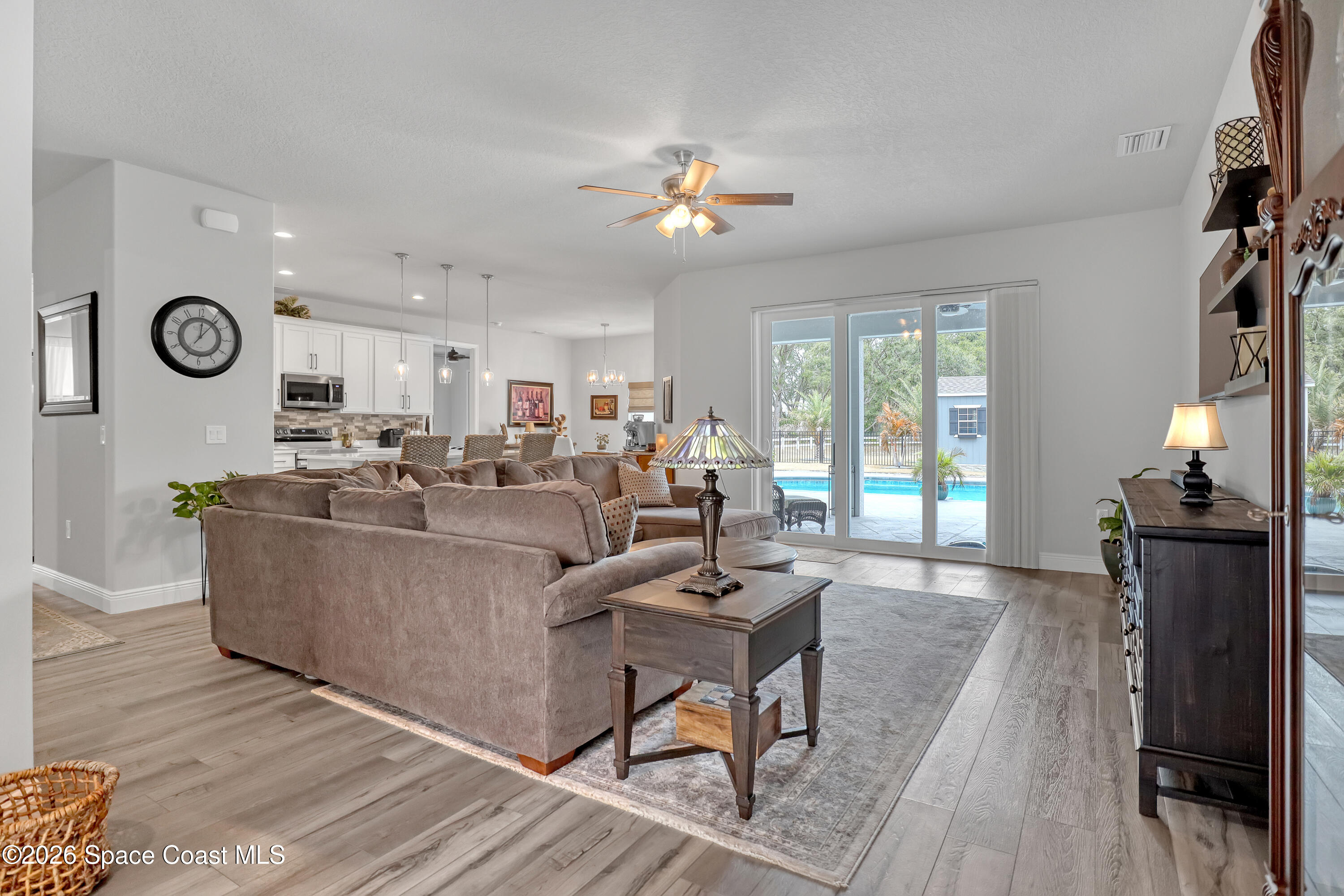 1837 Market Circle Northeast Palm Bay, FL 32905 - Photo 16 of 57 a living room with furniture and wooden floor