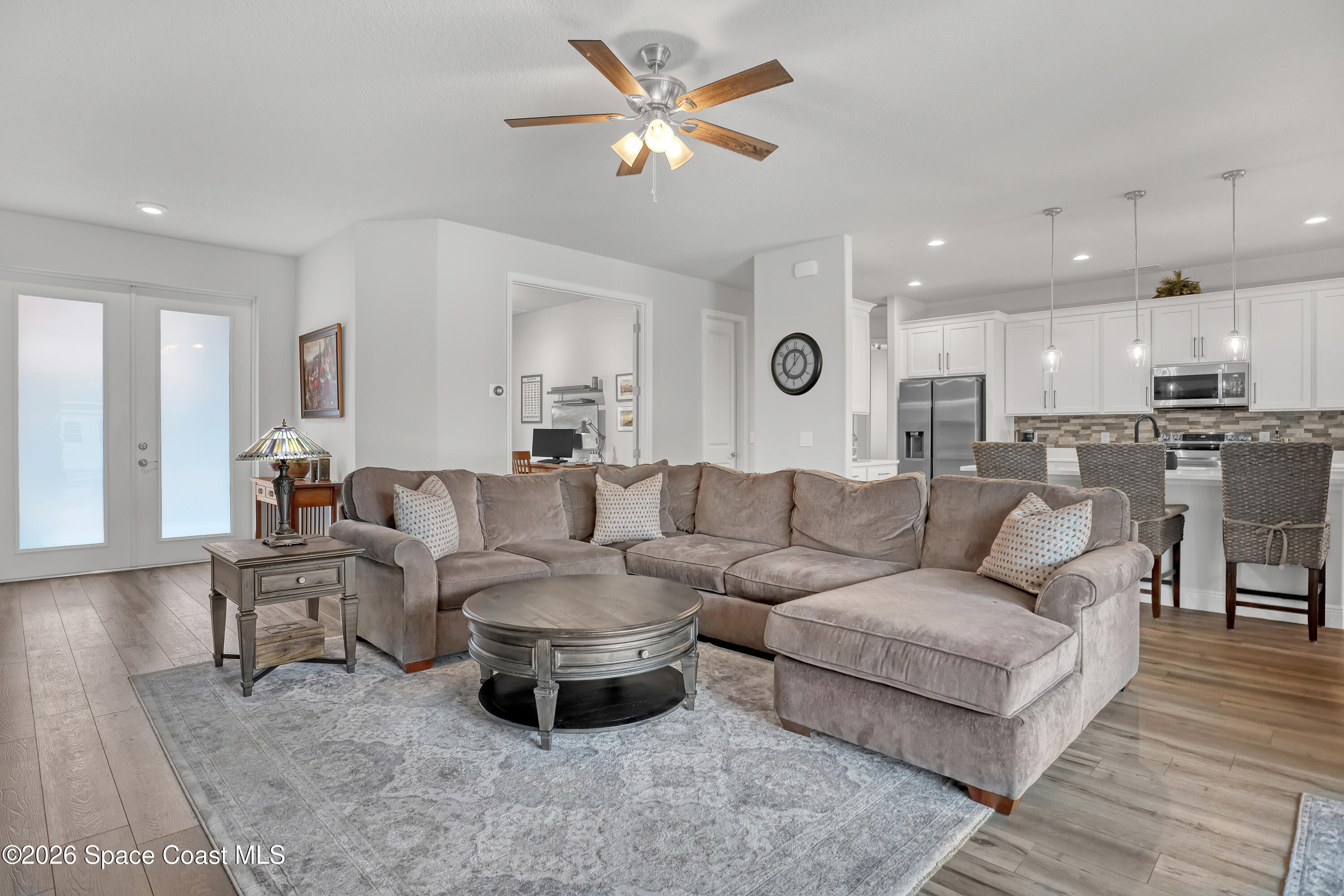1837 Market Circle Northeast Palm Bay, FL 32905 - Photo 19 of 57 a living room with furniture and kitchen view