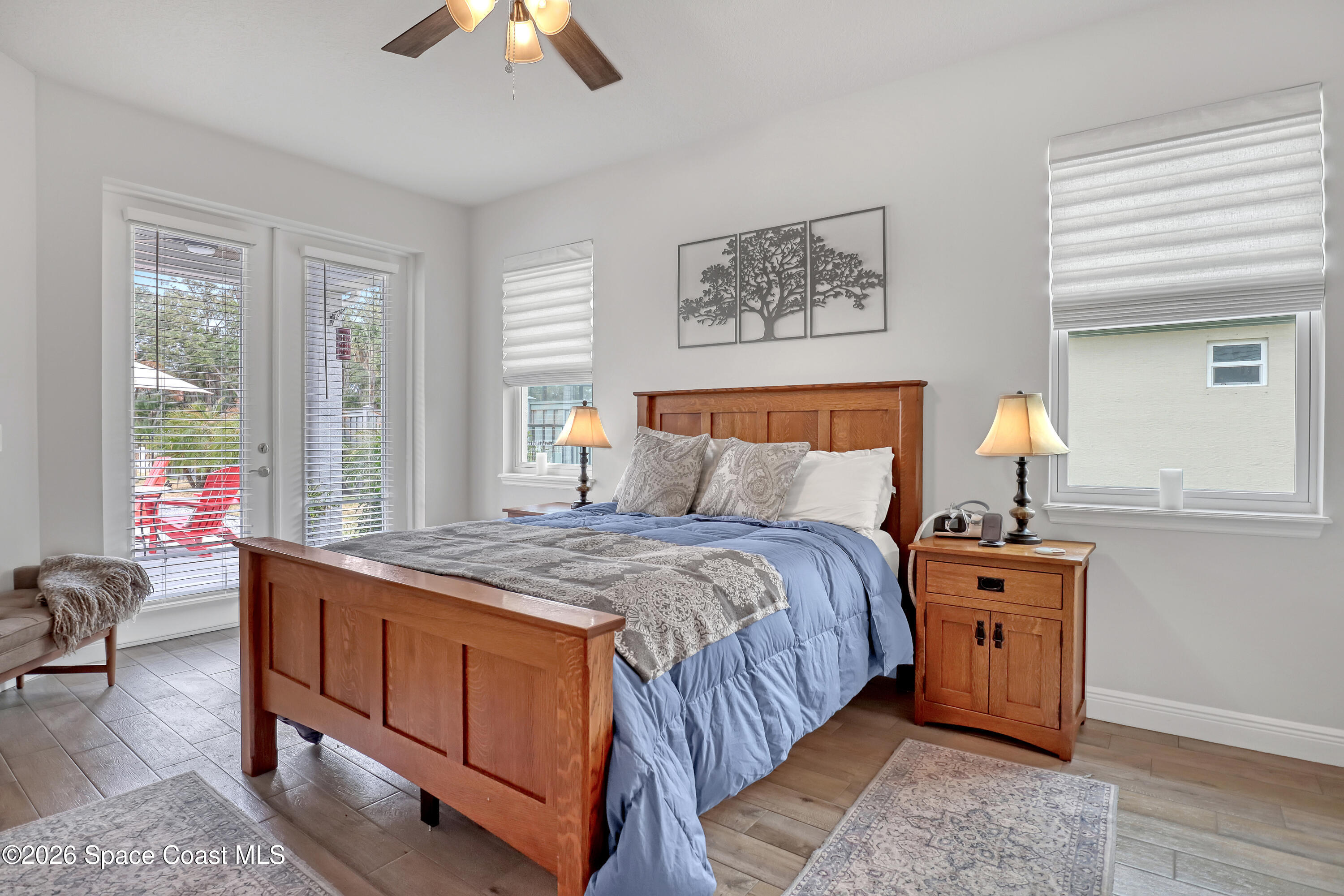 1837 Market Circle Northeast Palm Bay, FL 32905 - Photo 21 of 57 a bedroom with a bed and a chandelier
