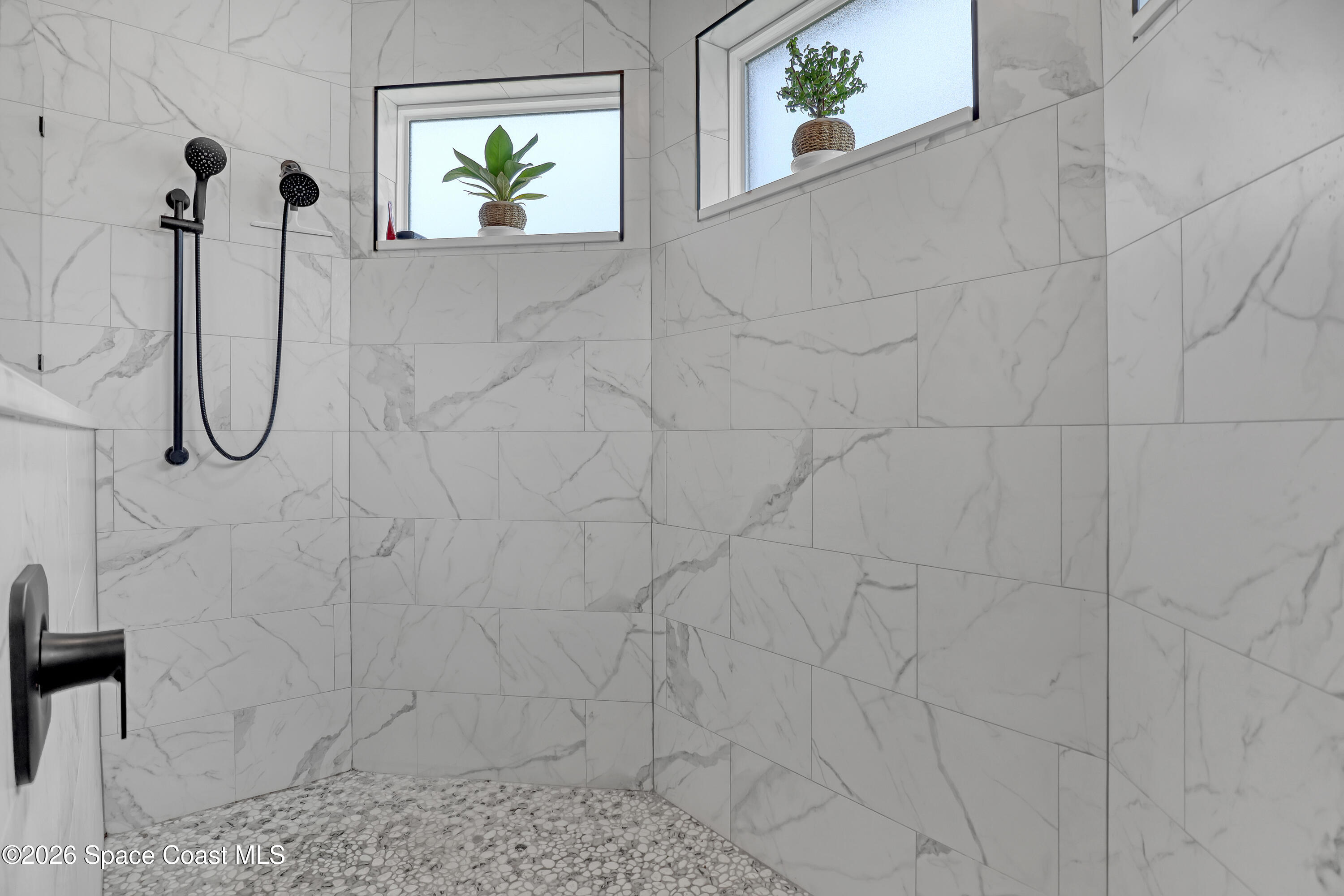 1837 Market Circle Northeast Palm Bay, FL 32905 - Photo 26 of 57 a bathroom with a shower