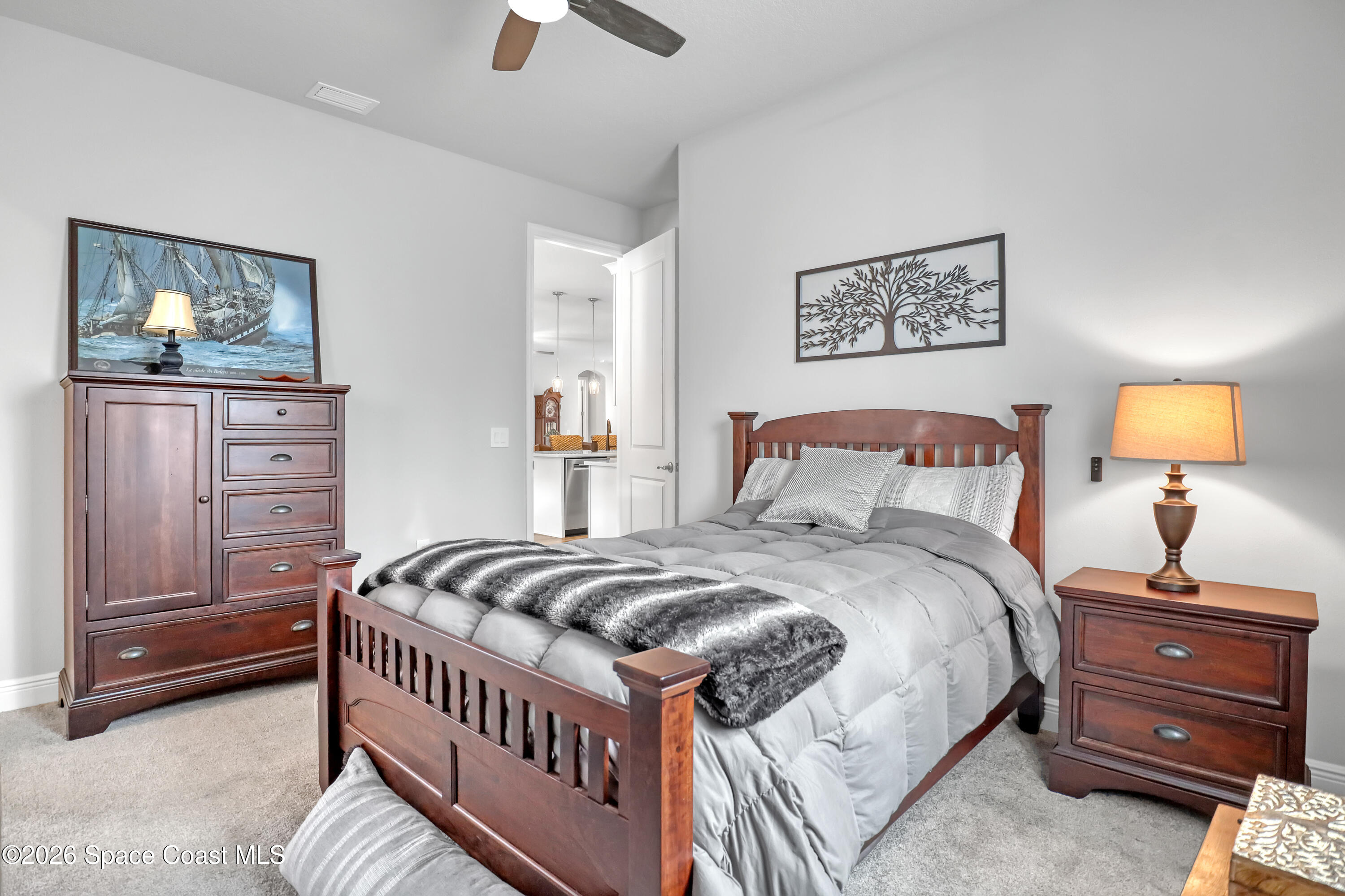 1837 Market Circle Northeast Palm Bay, FL 32905 - Photo 28 of 57 a bedroom with a bed and painting on the wall