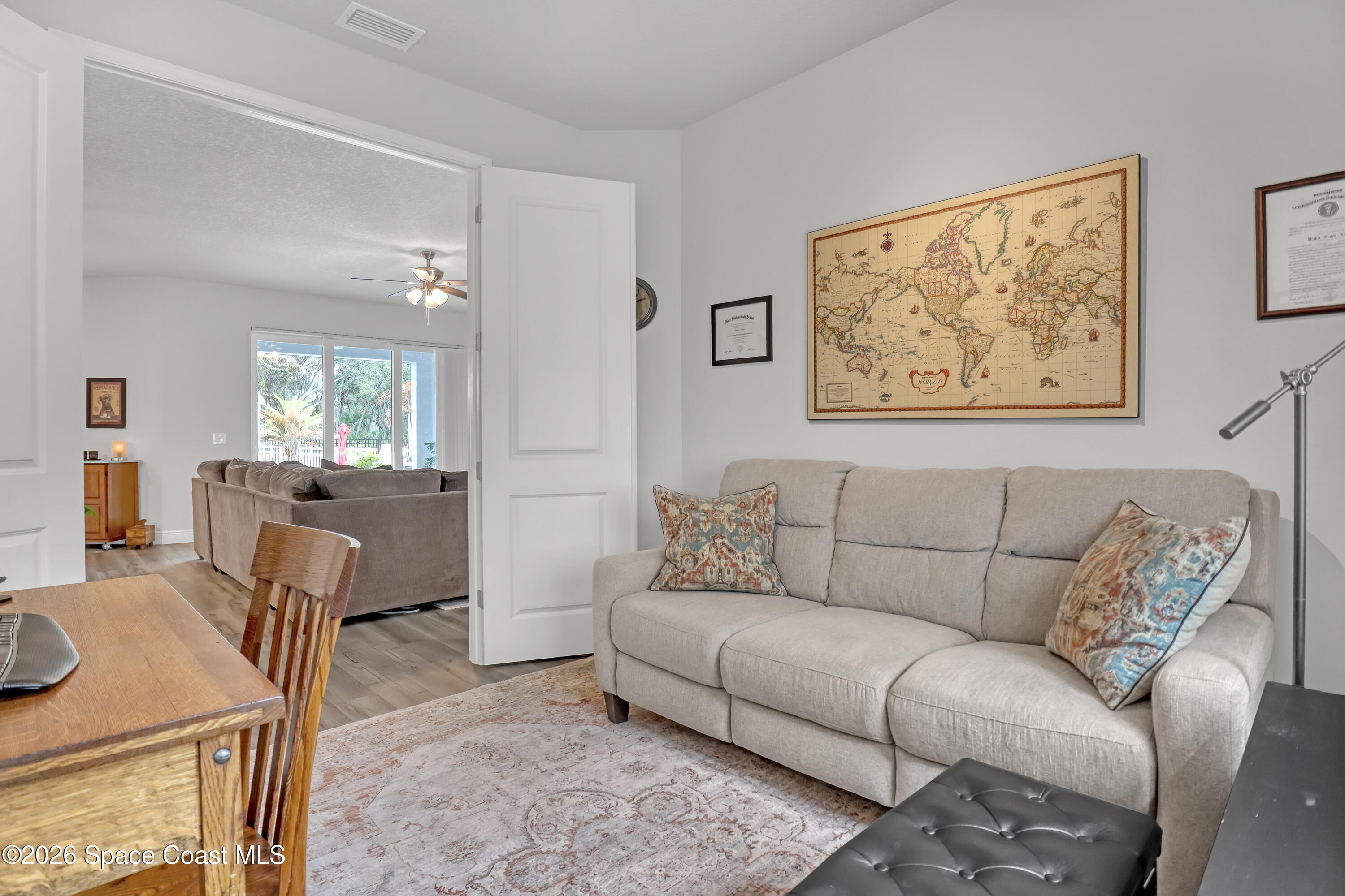 1837 Market Circle Northeast Palm Bay, FL 32905 - Photo 35 of 57 a living room with furniture and a table