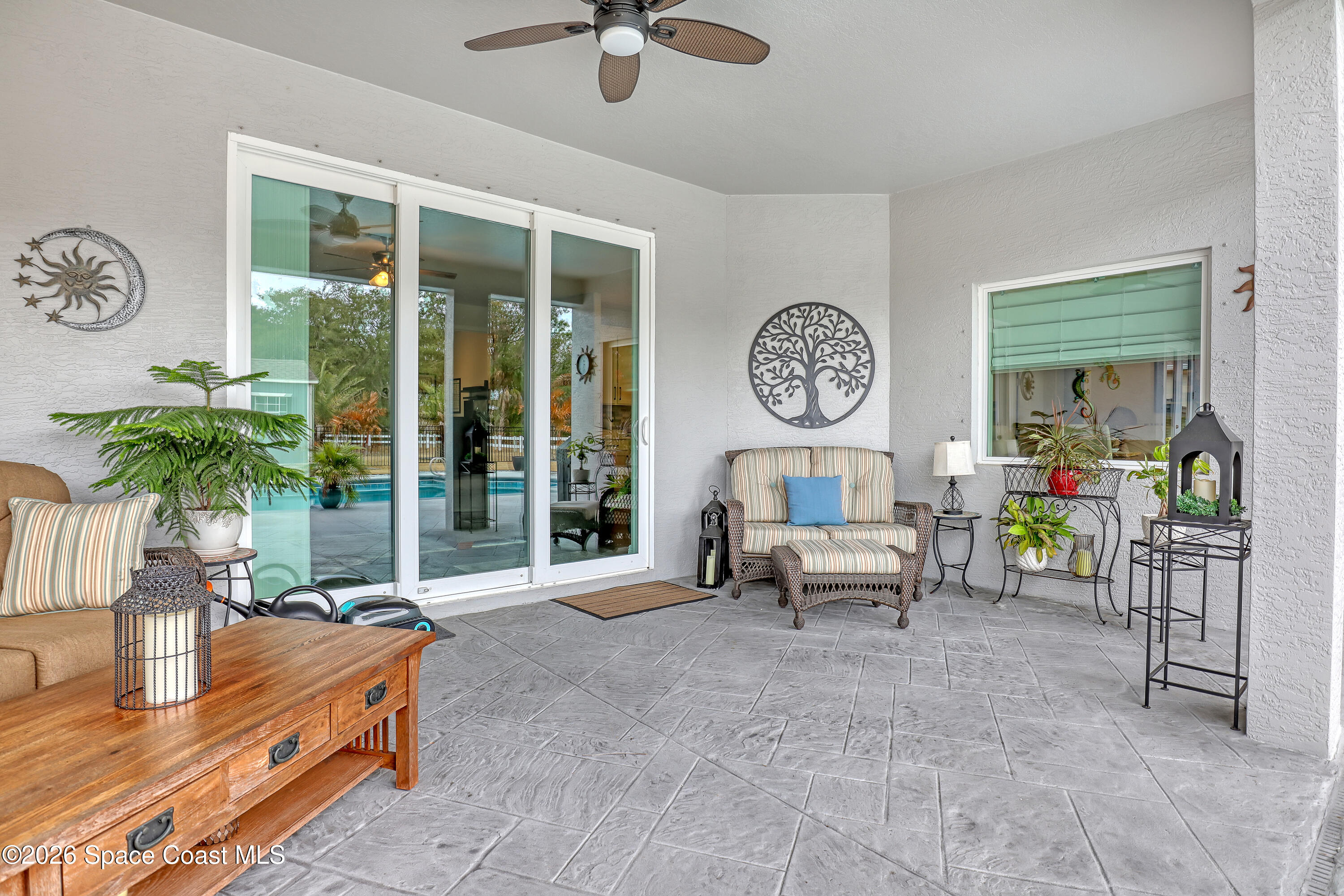 1837 Market Circle Northeast Palm Bay, FL 32905 - Photo 38 of 57 a living room with furniture and a large window
