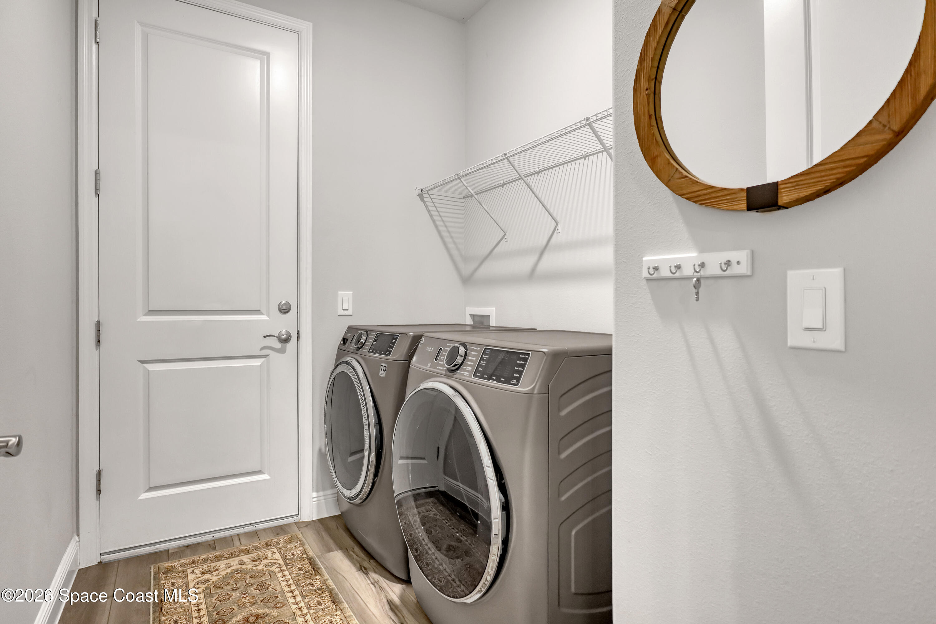 1837 Market Circle Northeast Palm Bay, FL 32905 - Photo 39 of 57 a utility room with dryer and washer
