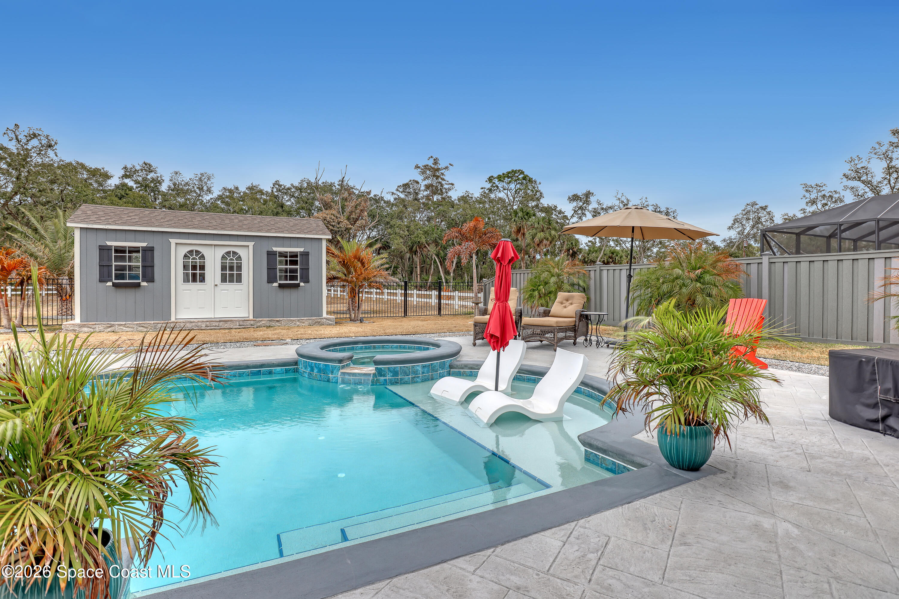 1837 Market Circle Northeast Palm Bay, FL 32905 - Photo 41 of 57 a view of a house with swimming pool and sitting area