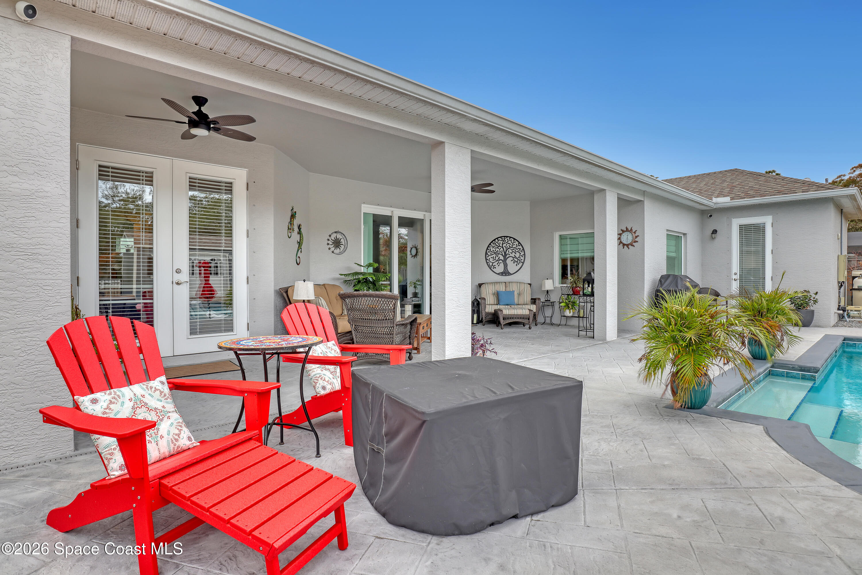 1837 Market Circle Northeast Palm Bay, FL 32905 - Photo 42 of 57 a living room filled with furniture and a potted plant
