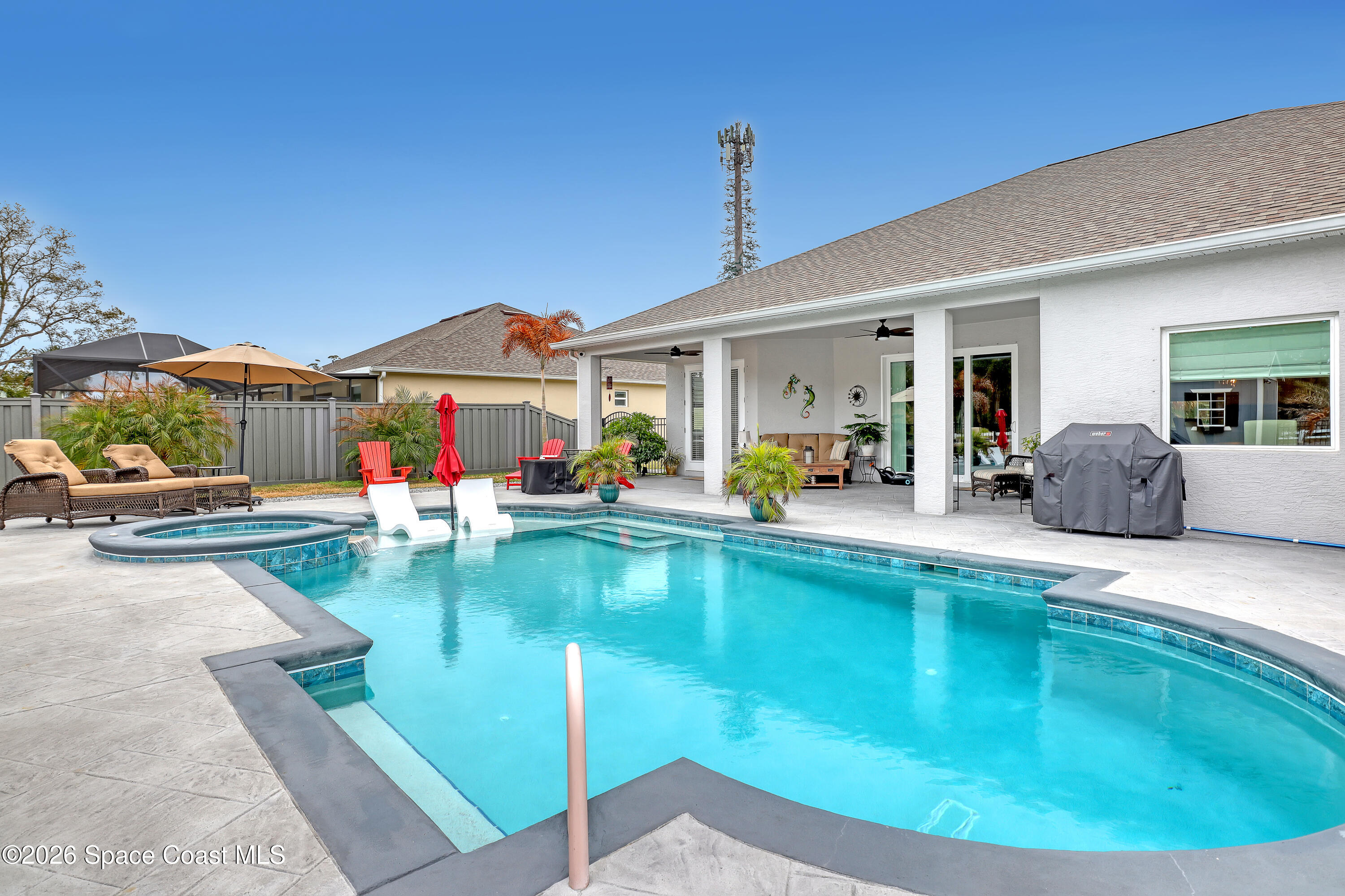 1837 Market Circle Northeast Palm Bay, FL 32905 - Photo 45 of 57 a view of a house with swimming pool