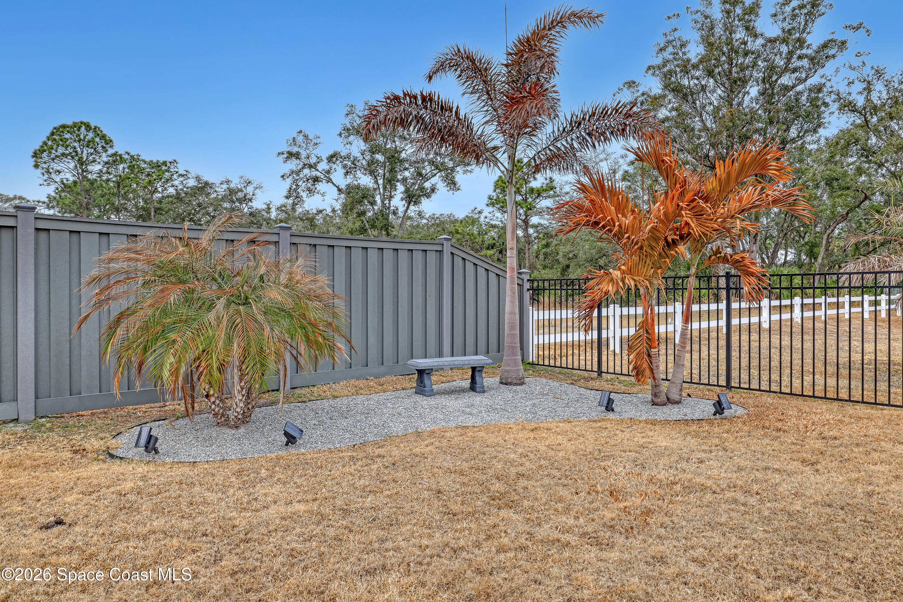 1837 Market Circle Northeast Palm Bay, FL 32905 - Photo 53 of 57 a backyard of a house with table and chairs