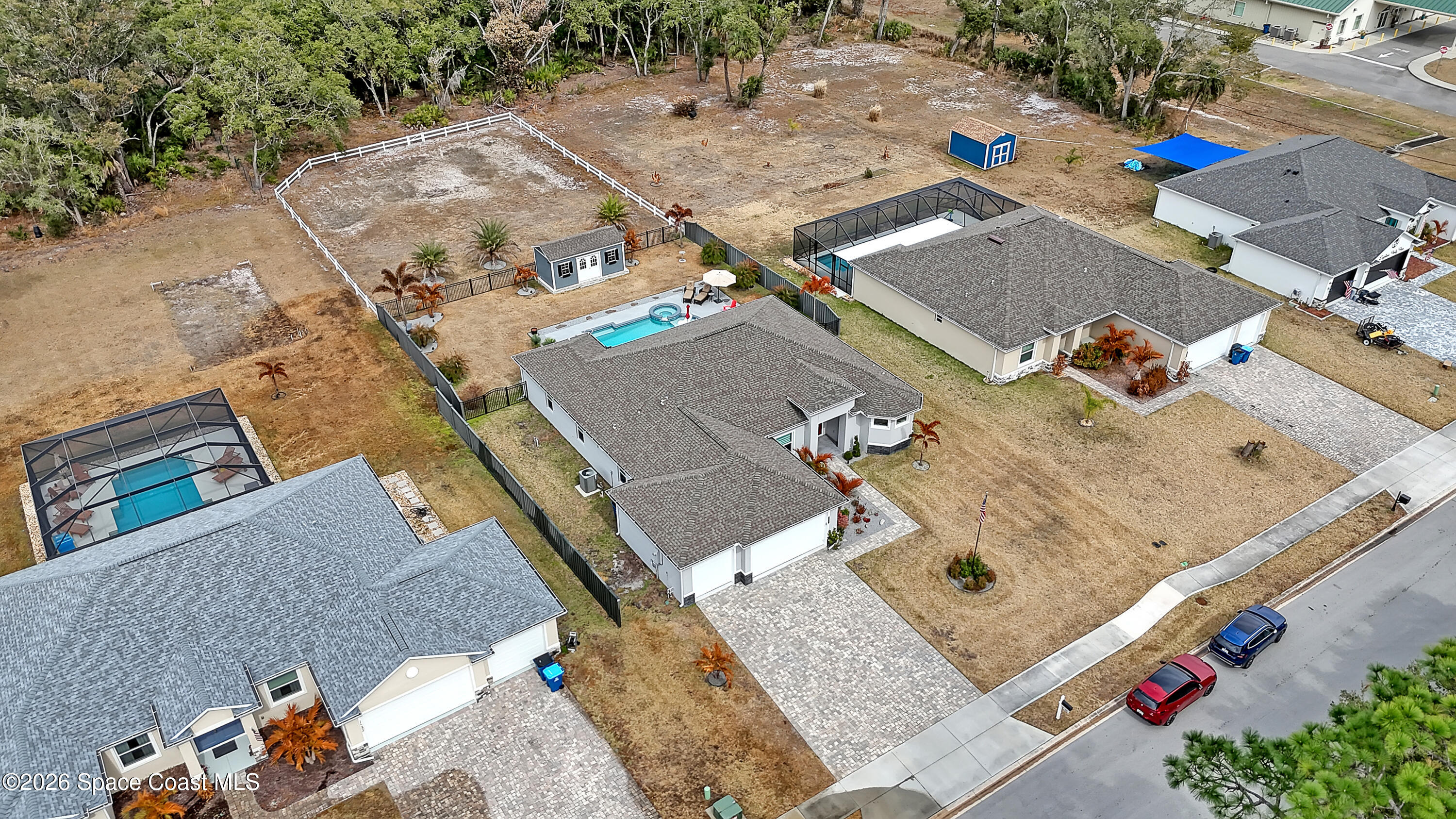 1837 Market Circle Northeast Palm Bay, FL 32905 - Photo 55 of 57 an aerial view of a house with a yard