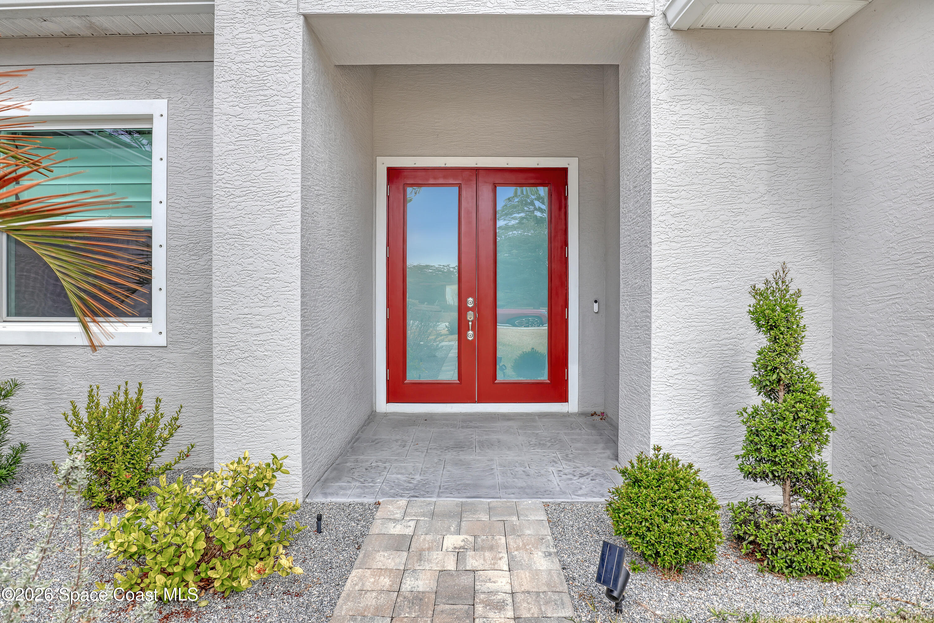 1837 Market Circle Northeast Palm Bay, FL 32905 - Photo 6 of 57 a front view of a house with a yard