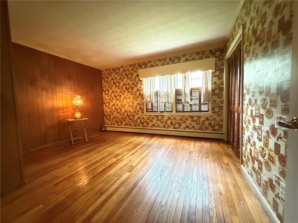 123 Hadley Road Greenville, PA 16125 - Photo 37 of 49 a view of an empty room with wooden floor and a window
