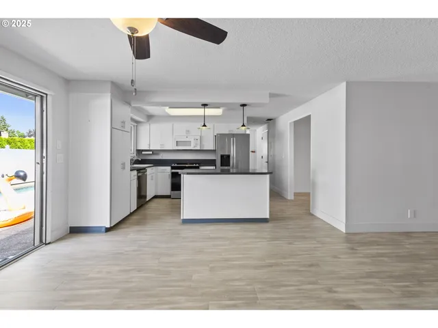 a view of kitchen with wooden floor