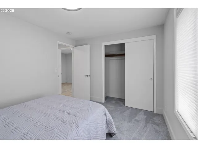 a bathroom with a double vanity sink toilet and a mirror