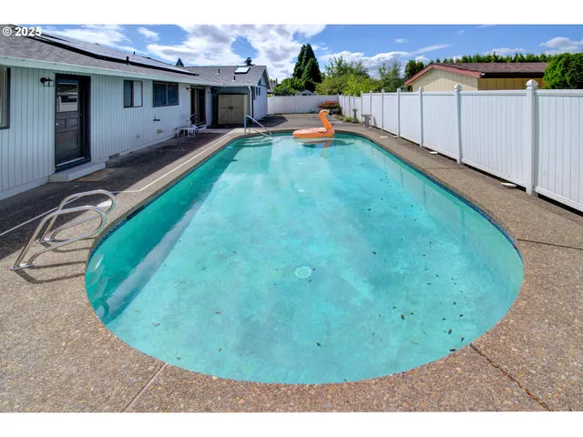a view of a backyard with a patio