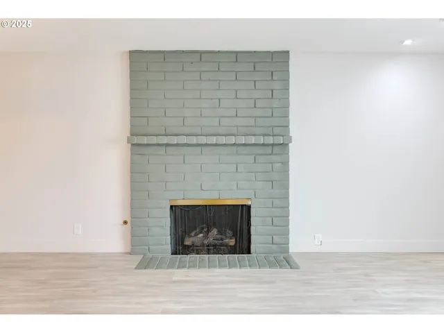 a stone house with a fireplace