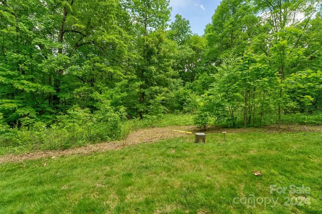 a view of outdoor space with deck and yard