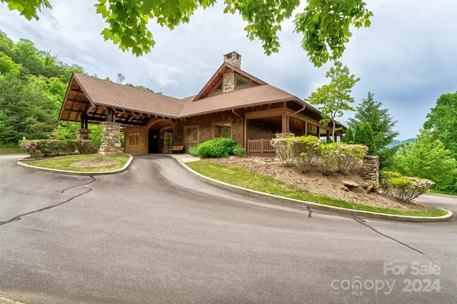 a front view of a house with a yard table and chairs