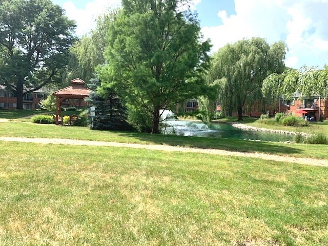 2403 South Goebbert Road, Unit 205 Arlington Heights, IL 60005 - Photo 11 of 13 a view of a house with a yard and sitting area