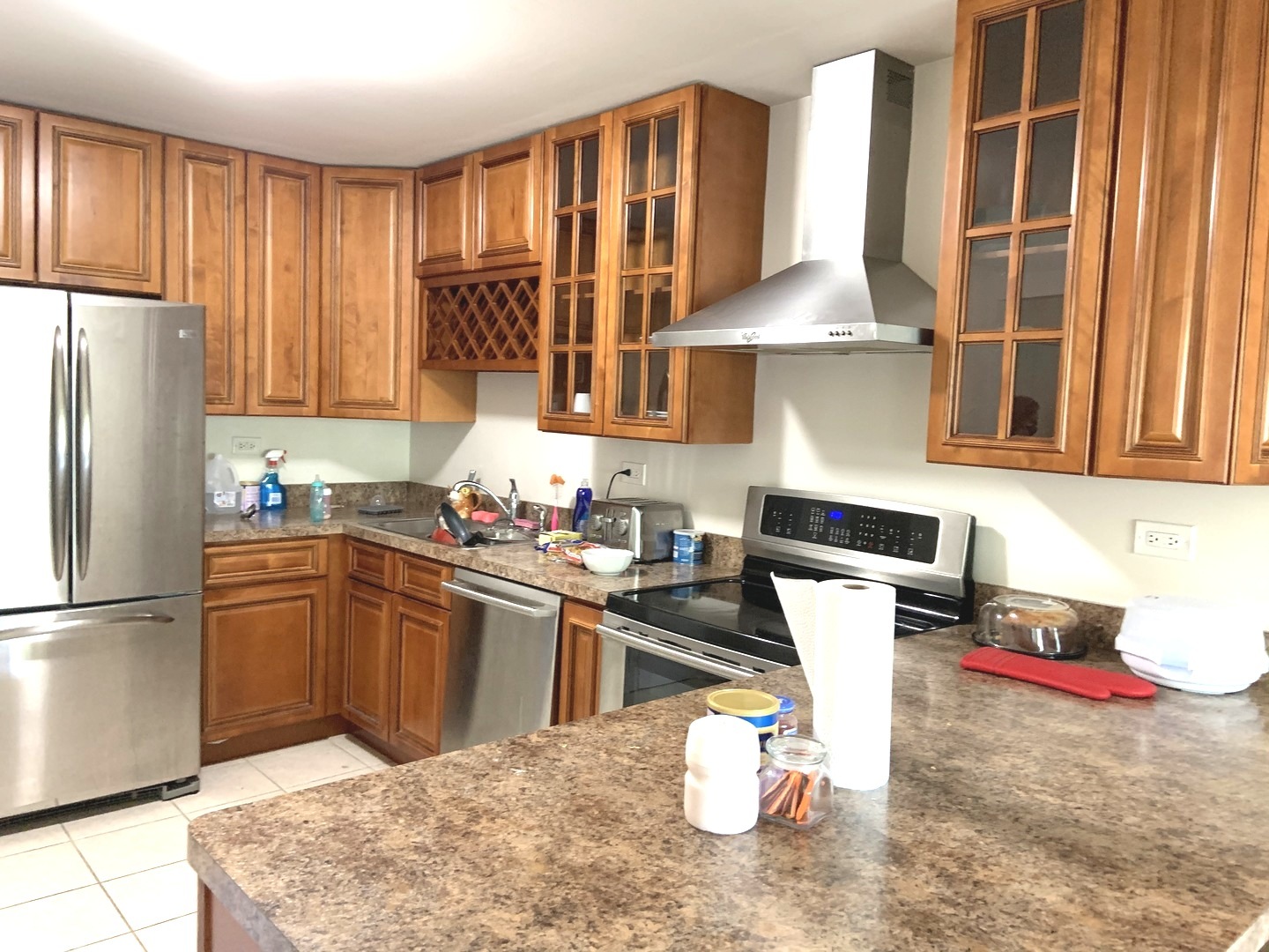 2403 South Goebbert Road, Unit 205 Arlington Heights, IL 60005 - Photo 3 of 13 a kitchen with stainless steel appliances granite countertop a sink refrigerator and cabinets
