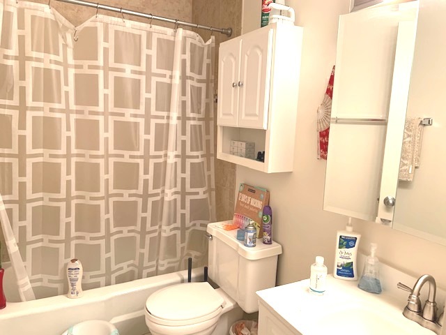 2403 South Goebbert Road, Unit 205 Arlington Heights, IL 60005 - Photo 7 of 13 a bathroom with a sink toilet and shower