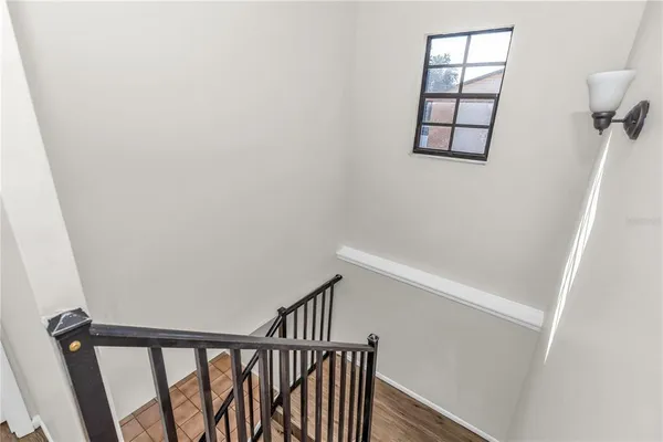a view of entryway with stairs and wooden floor