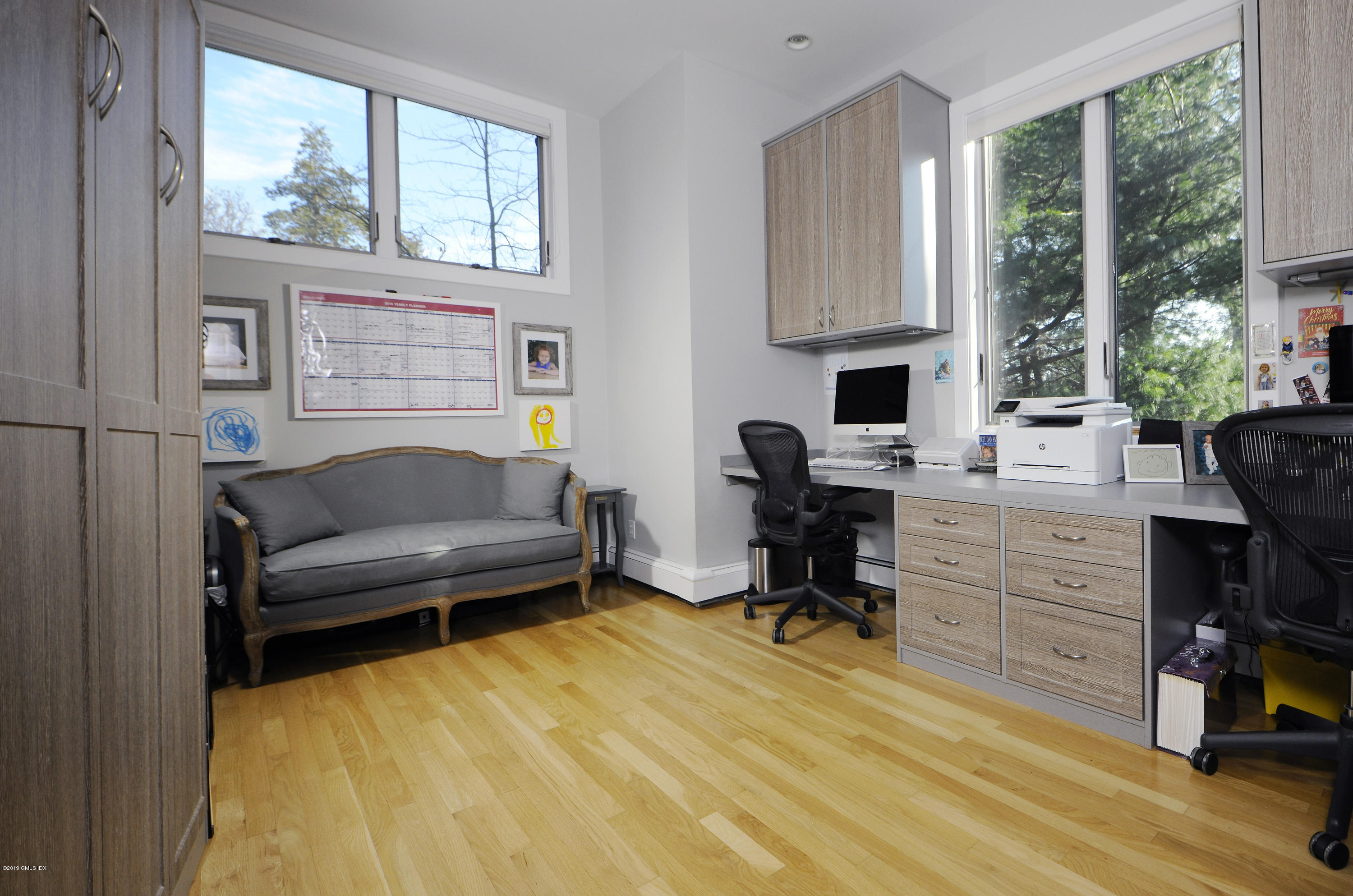 249 Shore Road Greenwich, CT 06830 - Photo 12 of 24 a livingroom with workspace and a window