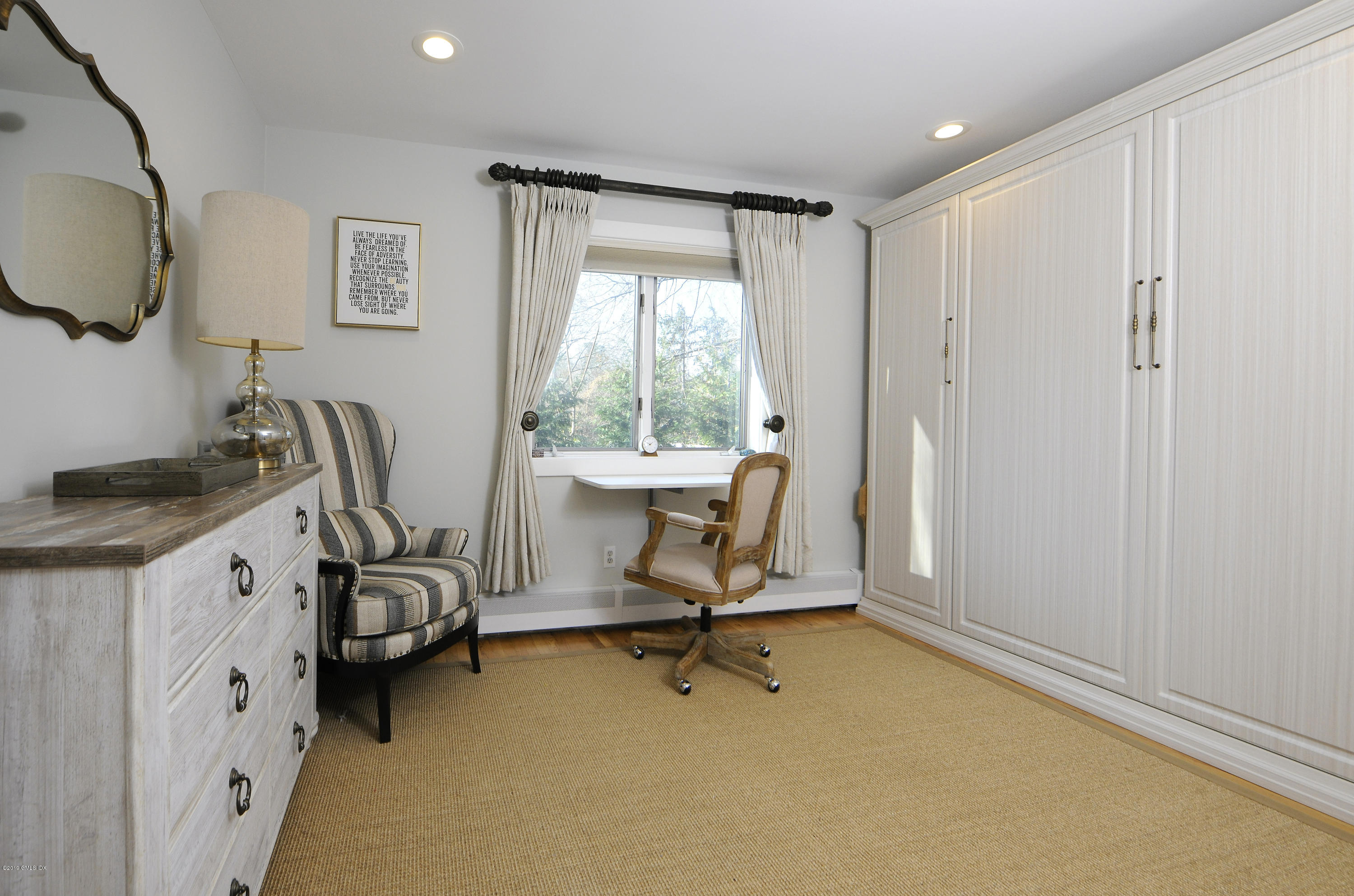 249 Shore Road Greenwich, CT 06830 - Photo 13 of 24 a view of a workspace with gym equipment