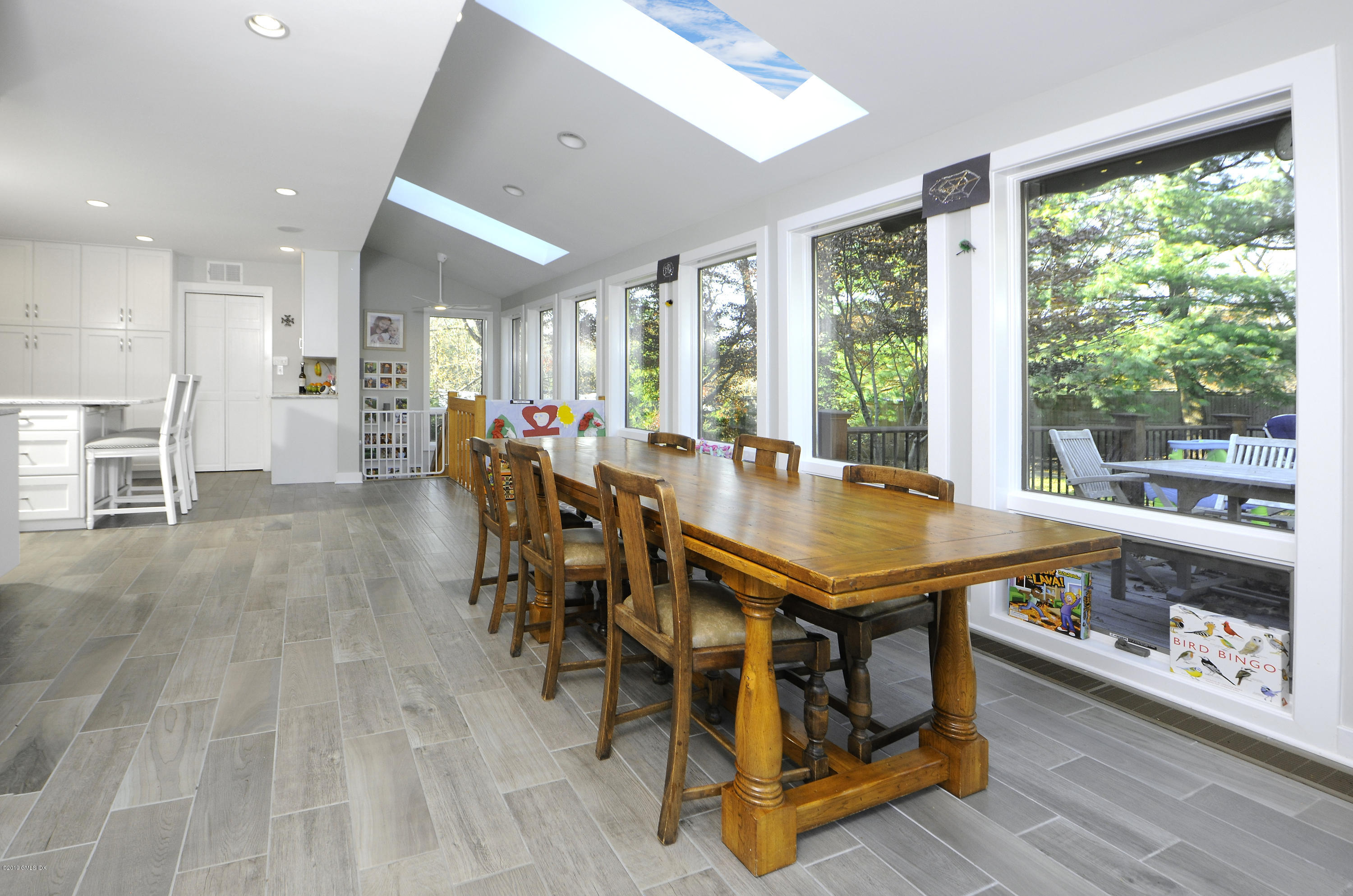 249 Shore Road Greenwich, CT 06830 - Photo 5 of 24 a view of a dining room with furniture window and wooden floor