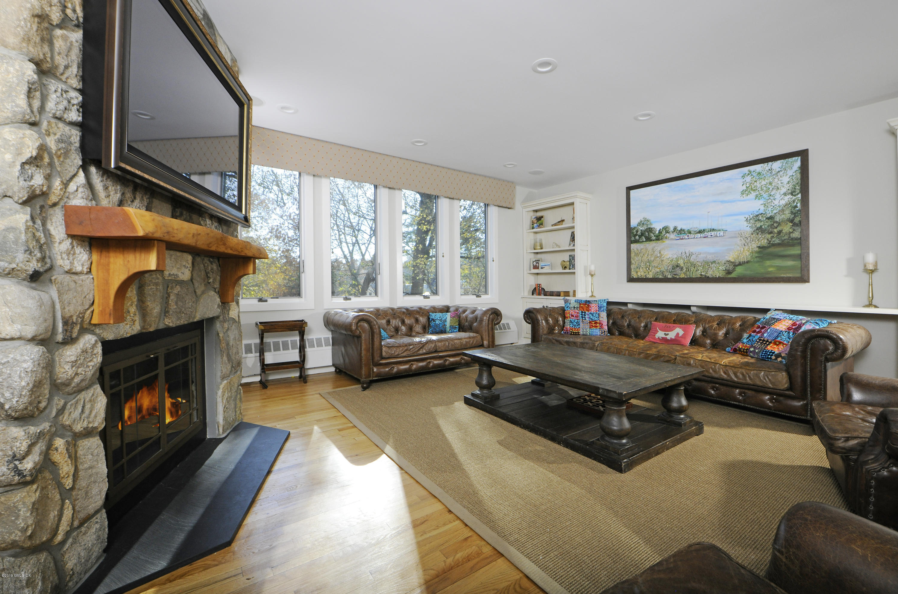 249 Shore Road Greenwich, CT 06830 - Photo 6 of 24 a living room with furniture fireplace and flat screen tv