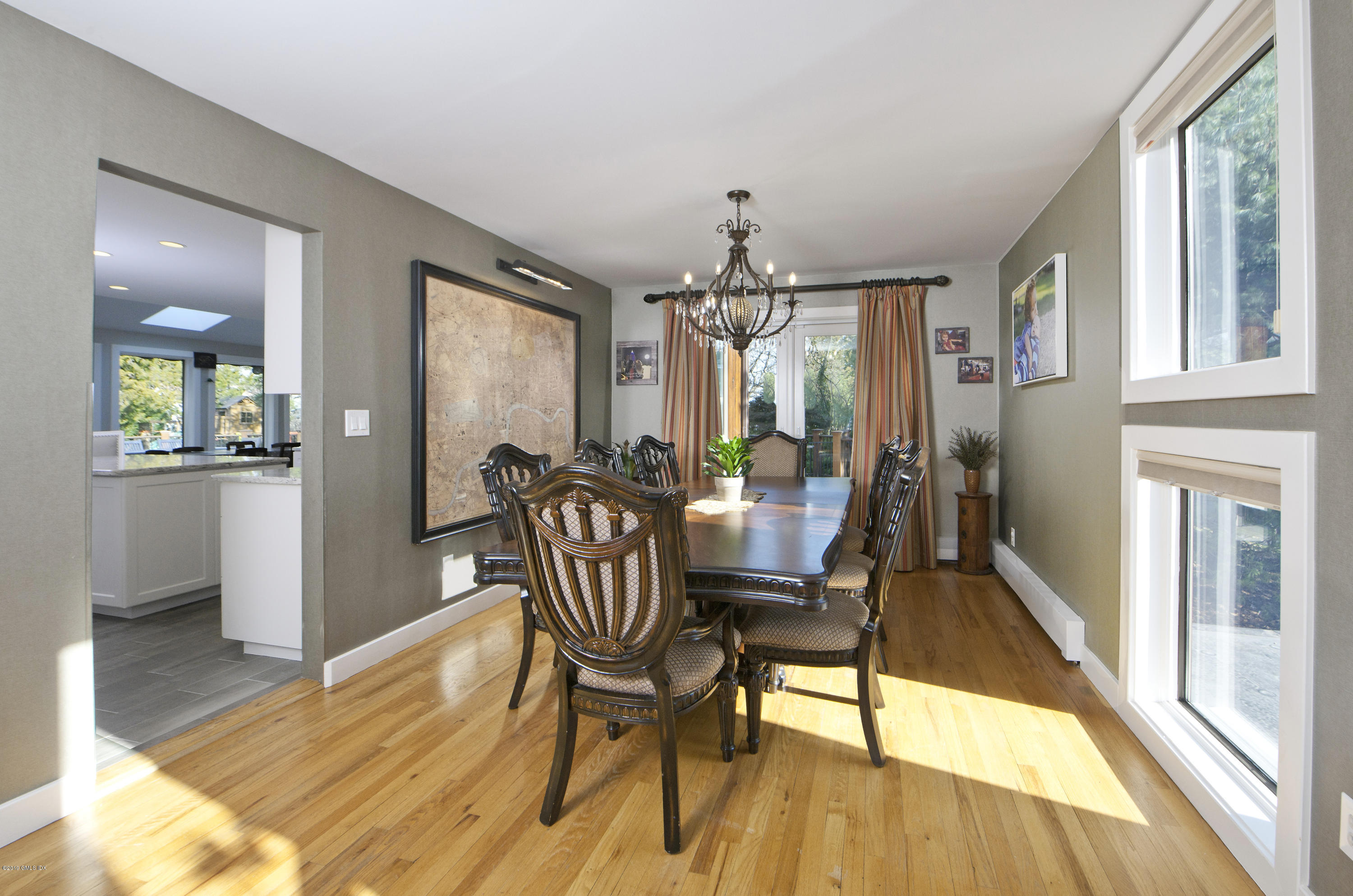249 Shore Road Greenwich, CT 06830 - Photo 7 of 24 a view of a dining room with furniture and wooden floor