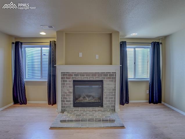 7975 Buschborn Road Peyton, CO 80831 - Photo 33 of 36 2nd fireplace in 2nd family room in basement