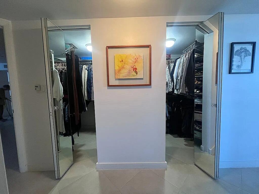 6463 La Costa Drive, Unit 105 Boca Raton, FL 33433 - Photo 26 of 40 a view of a hallway with closet and a bathroom